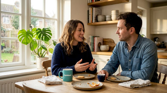 Couple talking about health at kitchen table