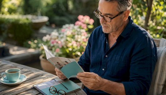 Man reading health screenings brochure at home