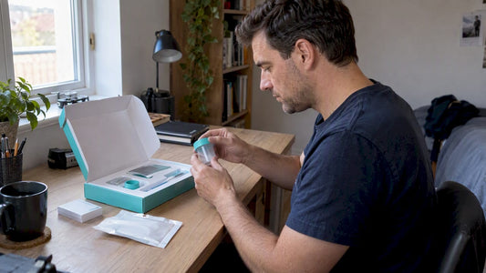 Man opening a home fertility screening kit