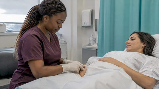 Clinician examining a small genital-area skin growth