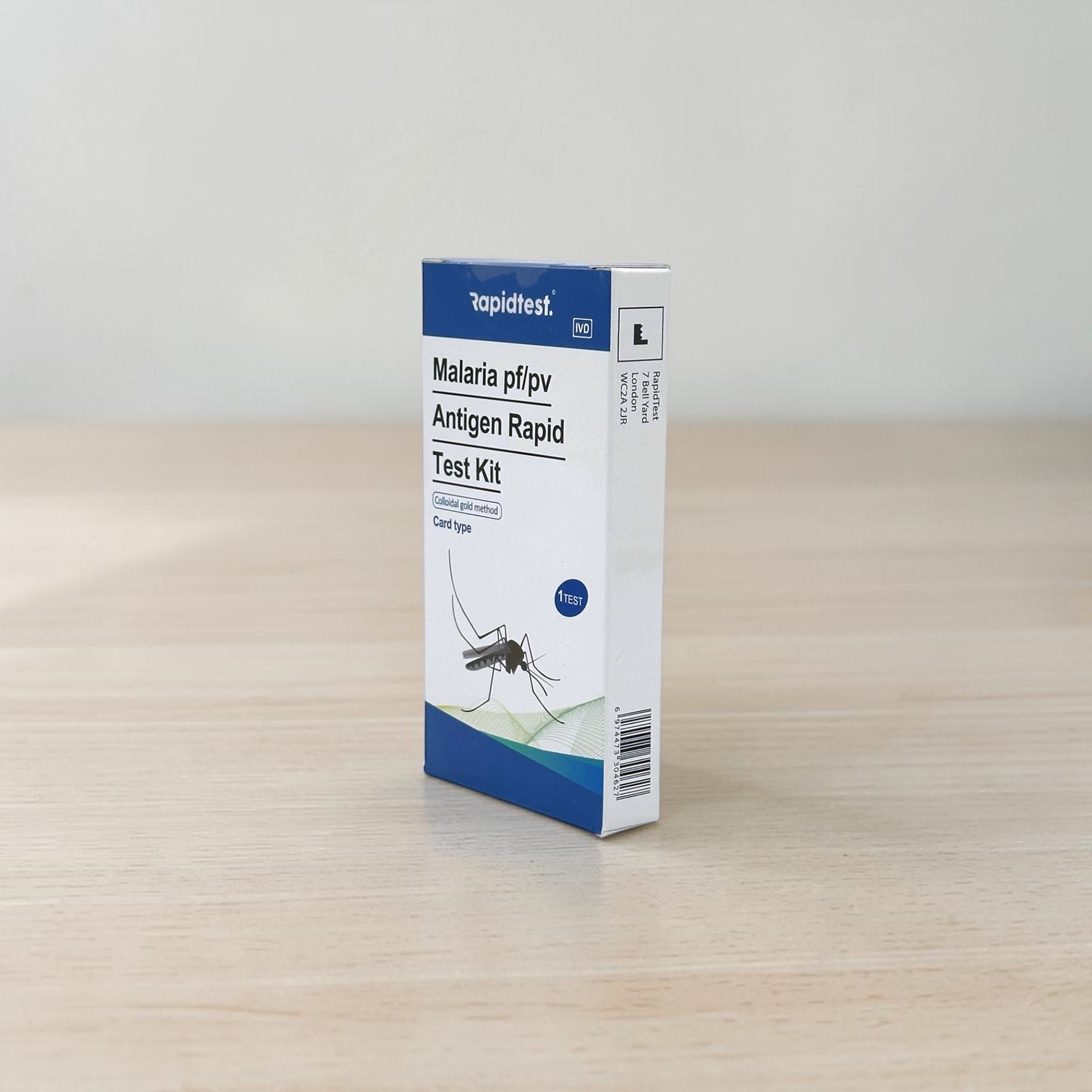 Malaria pf/pv Antigen self test at home kit - Travel Tests on wood table - rapidtest.co