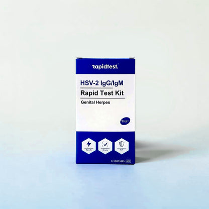 Rapid test kit for HSV-2 IgG/IgM Rapid Test Kit on a laboratory counter with a microscope and beakers. Buy an at-home genital herpes test kit - rapidtest.co